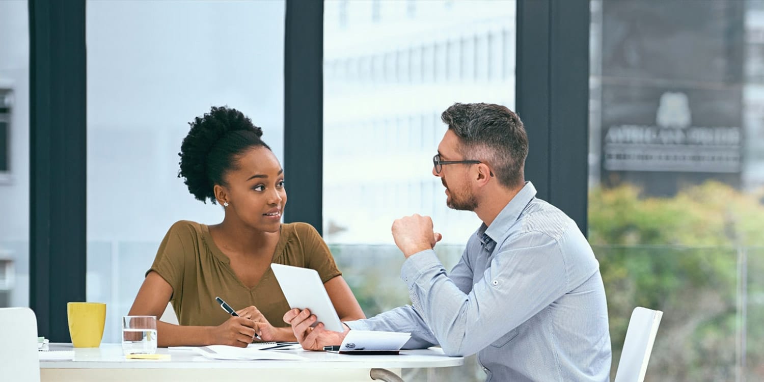 coworkers discussing pay 